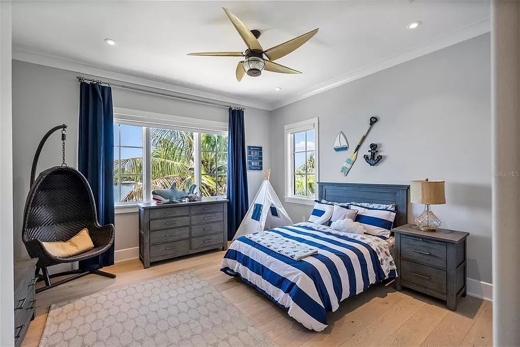 Indulge in the pinnacle of waterfront luxury living at 117 Bay Point Dr NE, Saint Petersburg, FL 33704. This exquisite property, nestled within the exclusive island enclave of Snell Isle, offers captivating ocean views from nearly every room, ensuring privacy and exclusivity among only 30 other houses.