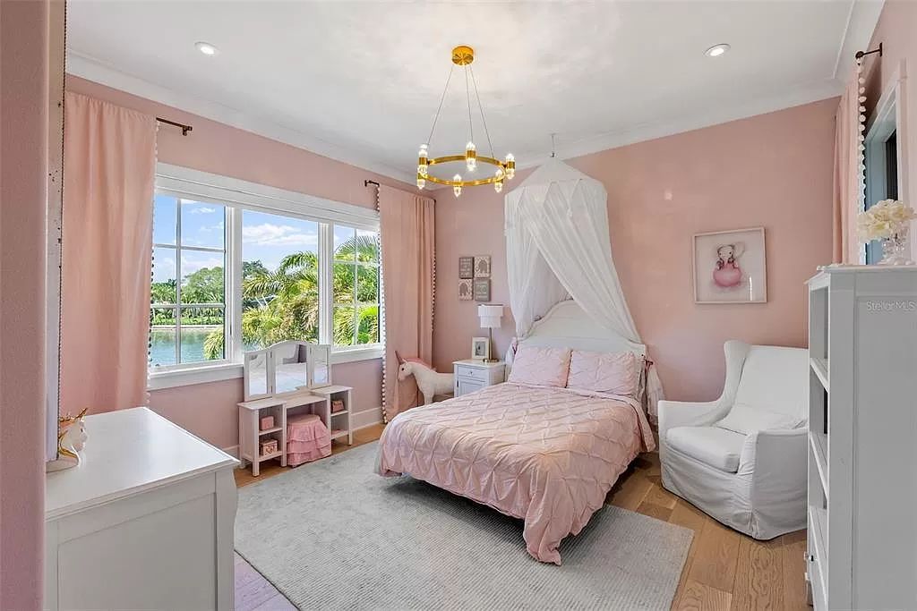 Indulge in the pinnacle of waterfront luxury living at 117 Bay Point Dr NE, Saint Petersburg, FL 33704. This exquisite property, nestled within the exclusive island enclave of Snell Isle, offers captivating ocean views from nearly every room, ensuring privacy and exclusivity among only 30 other houses.