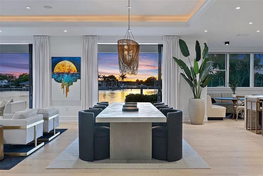 Indulge in the pinnacle of waterfront luxury living at 117 Bay Point Dr NE, Saint Petersburg, FL 33704. This exquisite property, nestled within the exclusive island enclave of Snell Isle, offers captivating ocean views from nearly every room, ensuring privacy and exclusivity among only 30 other houses.