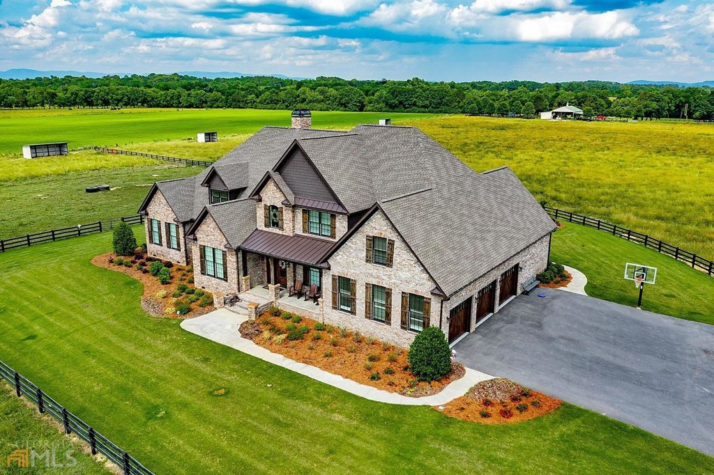 1211 Owens Gin Road NE Home in Calhoun, Georgia. Explore the beauty of this 39.55-acre farm nestled in Northwest Georgia, featuring a stunning home overlooking a stocked lake and the Coosawattee River.