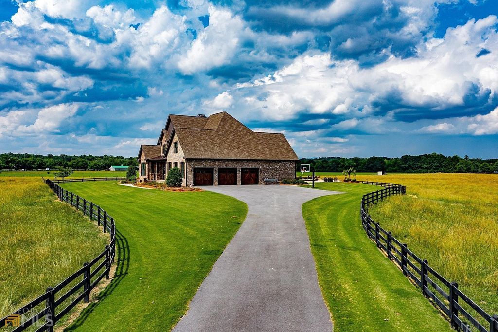 1211 Owens Gin Road NE Home in Calhoun, Georgia. Explore the beauty of this 39.55-acre farm nestled in Northwest Georgia, featuring a stunning home overlooking a stocked lake and the Coosawattee River.
