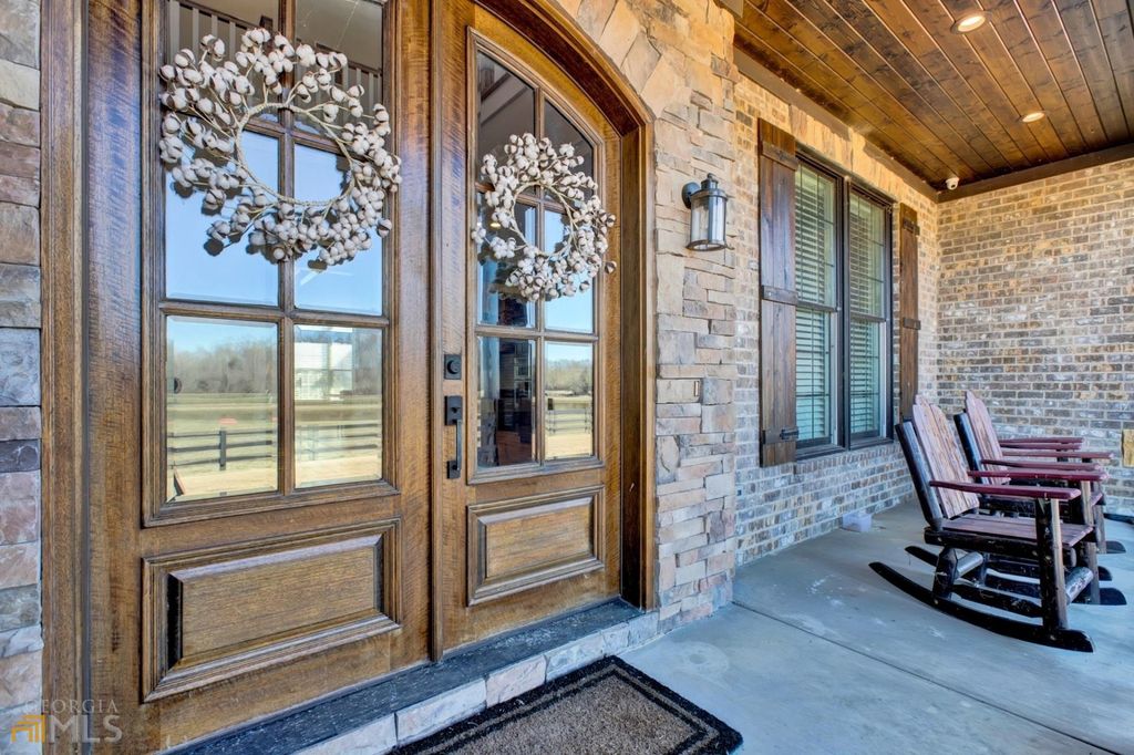1211 Owens Gin Road NE Home in Calhoun, Georgia. Explore the beauty of this 39.55-acre farm nestled in Northwest Georgia, featuring a stunning home overlooking a stocked lake and the Coosawattee River.