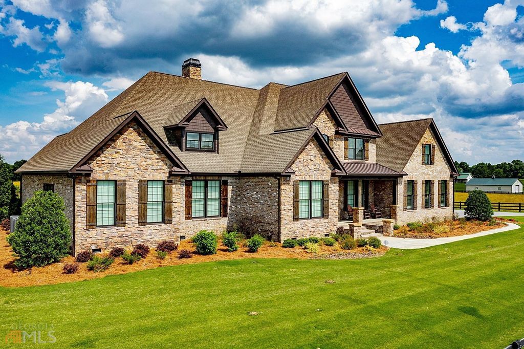 1211 Owens Gin Road NE Home in Calhoun, Georgia. Explore the beauty of this 39.55-acre farm nestled in Northwest Georgia, featuring a stunning home overlooking a stocked lake and the Coosawattee River.