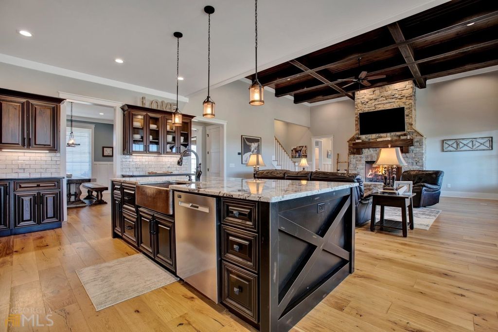 1211 Owens Gin Road NE Home in Calhoun, Georgia. Explore the beauty of this 39.55-acre farm nestled in Northwest Georgia, featuring a stunning home overlooking a stocked lake and the Coosawattee River.