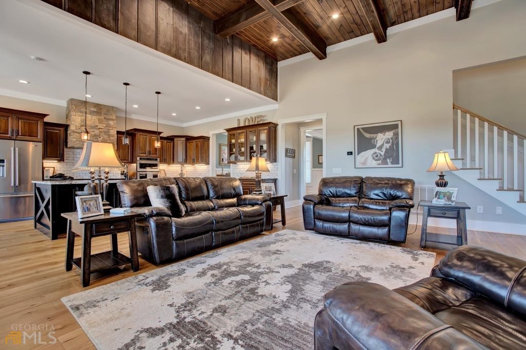 1211 Owens Gin Road NE Home in Calhoun, Georgia. Explore the beauty of this 39.55-acre farm nestled in Northwest Georgia, featuring a stunning home overlooking a stocked lake and the Coosawattee River.