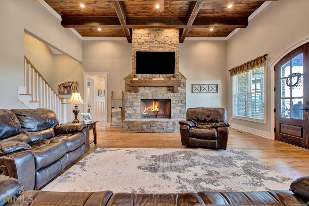 1211 Owens Gin Road NE Home in Calhoun, Georgia. Explore the beauty of this 39.55-acre farm nestled in Northwest Georgia, featuring a stunning home overlooking a stocked lake and the Coosawattee River.