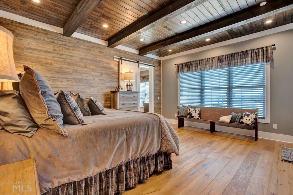 1211 Owens Gin Road NE Home in Calhoun, Georgia. Explore the beauty of this 39.55-acre farm nestled in Northwest Georgia, featuring a stunning home overlooking a stocked lake and the Coosawattee River.