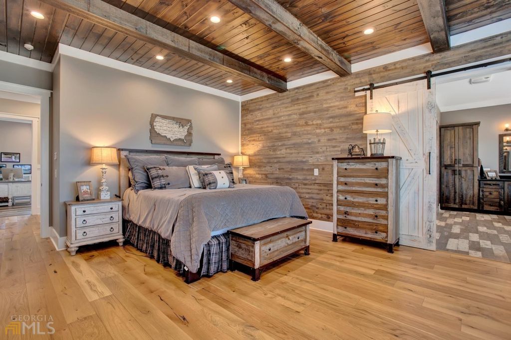 1211 Owens Gin Road NE Home in Calhoun, Georgia. Explore the beauty of this 39.55-acre farm nestled in Northwest Georgia, featuring a stunning home overlooking a stocked lake and the Coosawattee River.