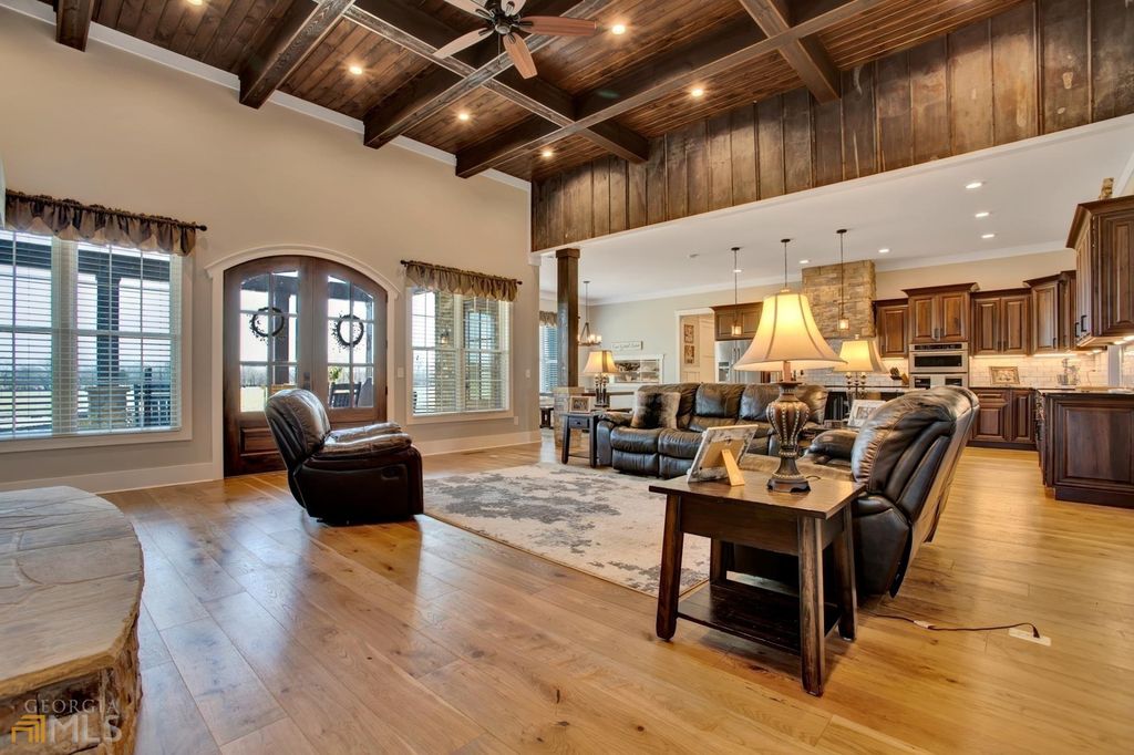 1211 Owens Gin Road NE Home in Calhoun, Georgia. Explore the beauty of this 39.55-acre farm nestled in Northwest Georgia, featuring a stunning home overlooking a stocked lake and the Coosawattee River.