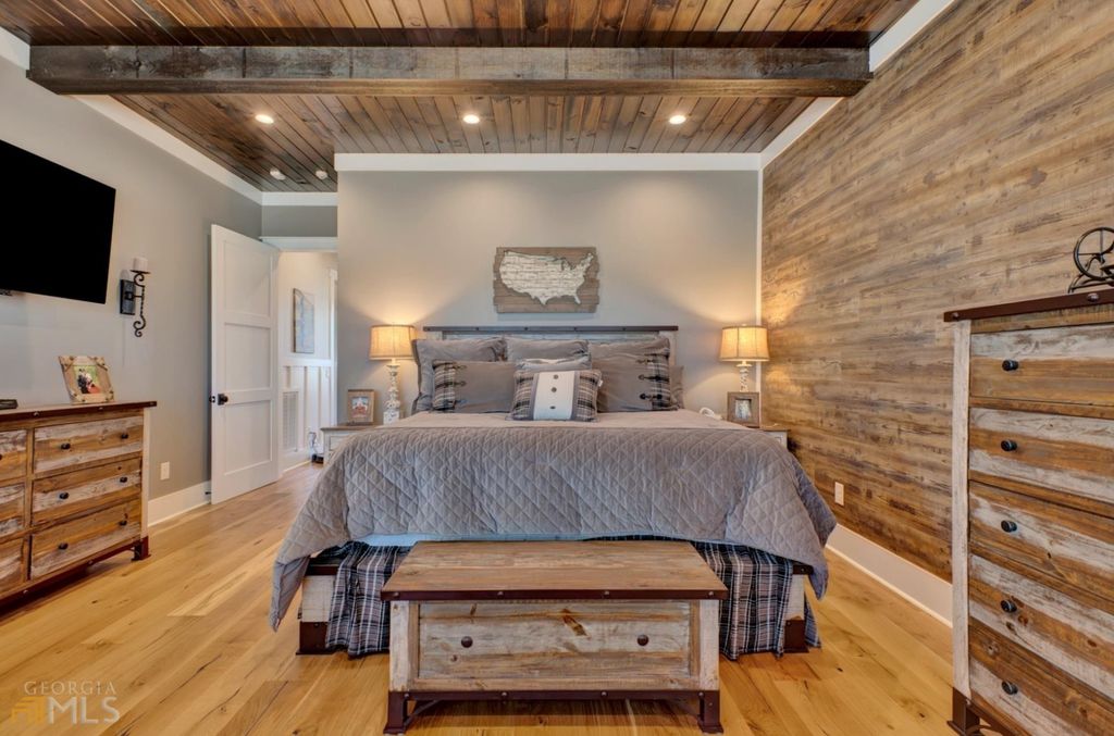 1211 Owens Gin Road NE Home in Calhoun, Georgia. Explore the beauty of this 39.55-acre farm nestled in Northwest Georgia, featuring a stunning home overlooking a stocked lake and the Coosawattee River.