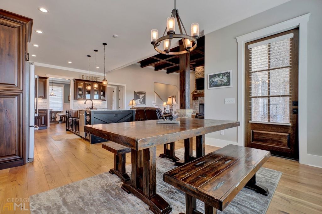 1211 Owens Gin Road NE Home in Calhoun, Georgia. Explore the beauty of this 39.55-acre farm nestled in Northwest Georgia, featuring a stunning home overlooking a stocked lake and the Coosawattee River.