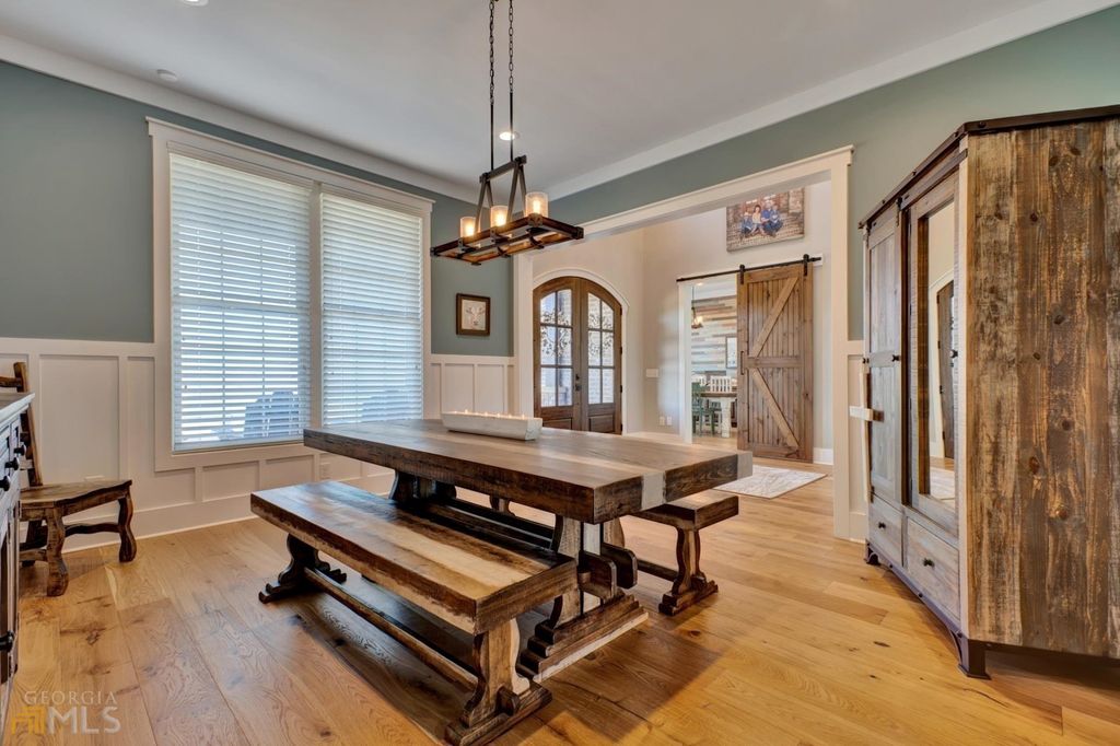 1211 Owens Gin Road NE Home in Calhoun, Georgia. Explore the beauty of this 39.55-acre farm nestled in Northwest Georgia, featuring a stunning home overlooking a stocked lake and the Coosawattee River.