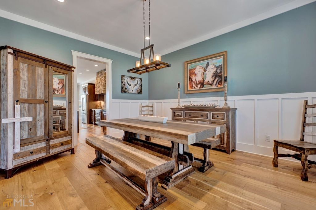 1211 Owens Gin Road NE Home in Calhoun, Georgia. Explore the beauty of this 39.55-acre farm nestled in Northwest Georgia, featuring a stunning home overlooking a stocked lake and the Coosawattee River.