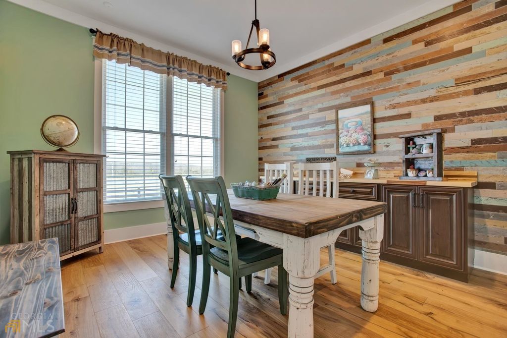 1211 Owens Gin Road NE Home in Calhoun, Georgia. Explore the beauty of this 39.55-acre farm nestled in Northwest Georgia, featuring a stunning home overlooking a stocked lake and the Coosawattee River.