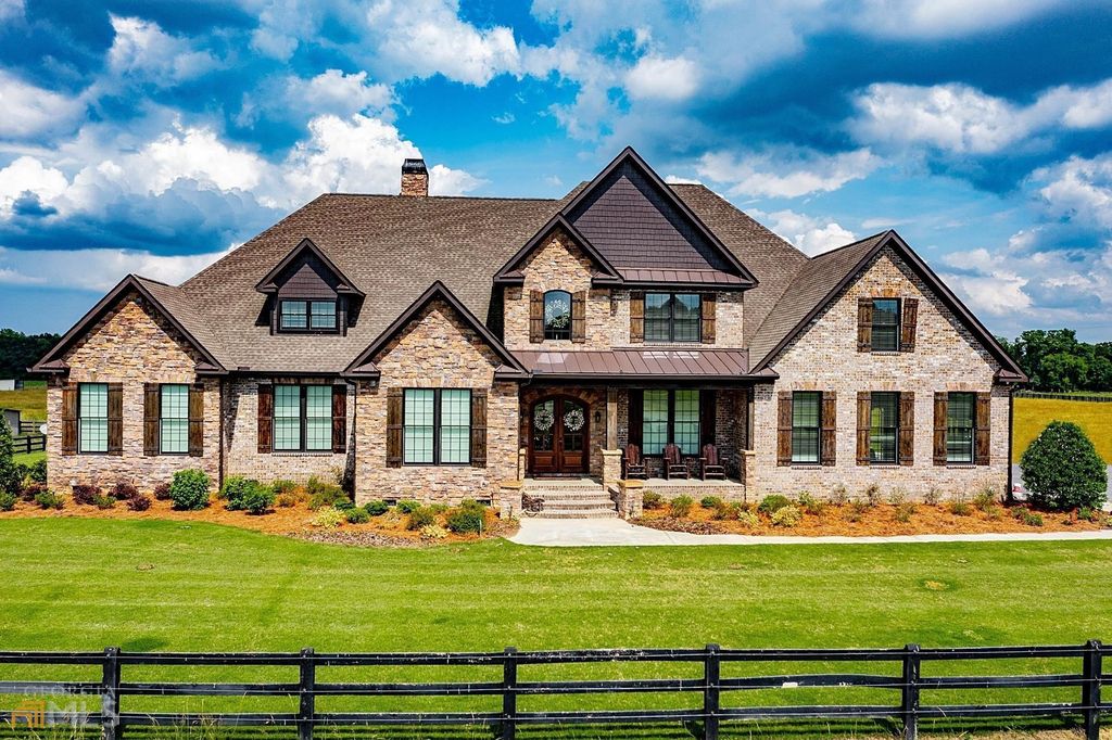 1211 Owens Gin Road NE Home in Calhoun, Georgia. Explore the beauty of this 39.55-acre farm nestled in Northwest Georgia, featuring a stunning home overlooking a stocked lake and the Coosawattee River.