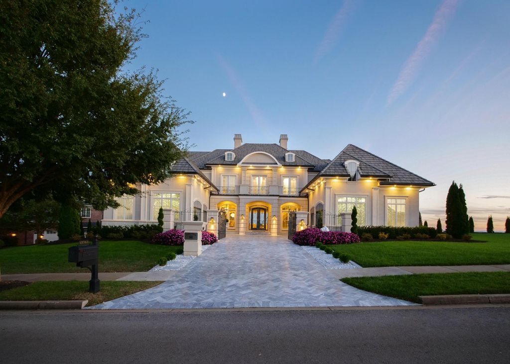 12768 Highwick Circle Home in Knoxville, Tennessee. Explore the epitome of luxury living at this architectural masterpiece nestled in prestigious Bridgemore. Perched atop Farragut's highest point, this one-of-a-kind home offers breathtaking views of the mountains and lake. 