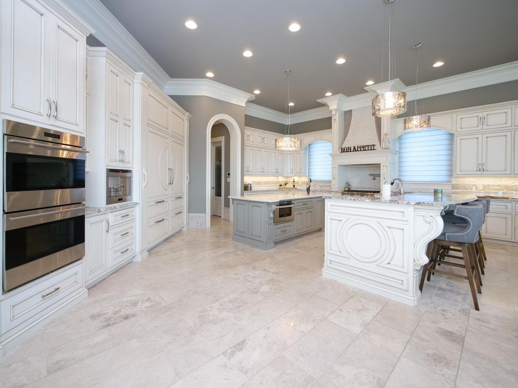 12768 Highwick Circle Home in Knoxville, Tennessee. Explore the epitome of luxury living at this architectural masterpiece nestled in prestigious Bridgemore. Perched atop Farragut's highest point, this one-of-a-kind home offers breathtaking views of the mountains and lake. 