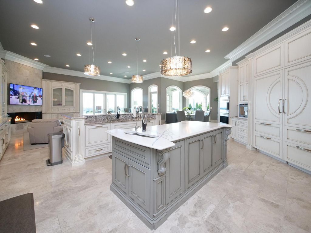 12768 Highwick Circle Home in Knoxville, Tennessee. Explore the epitome of luxury living at this architectural masterpiece nestled in prestigious Bridgemore. Perched atop Farragut's highest point, this one-of-a-kind home offers breathtaking views of the mountains and lake. 