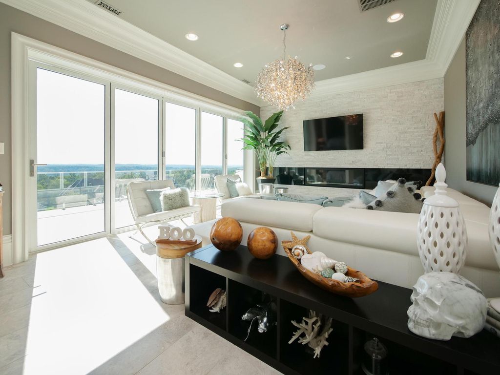 12768 Highwick Circle Home in Knoxville, Tennessee. Explore the epitome of luxury living at this architectural masterpiece nestled in prestigious Bridgemore. Perched atop Farragut's highest point, this one-of-a-kind home offers breathtaking views of the mountains and lake. 