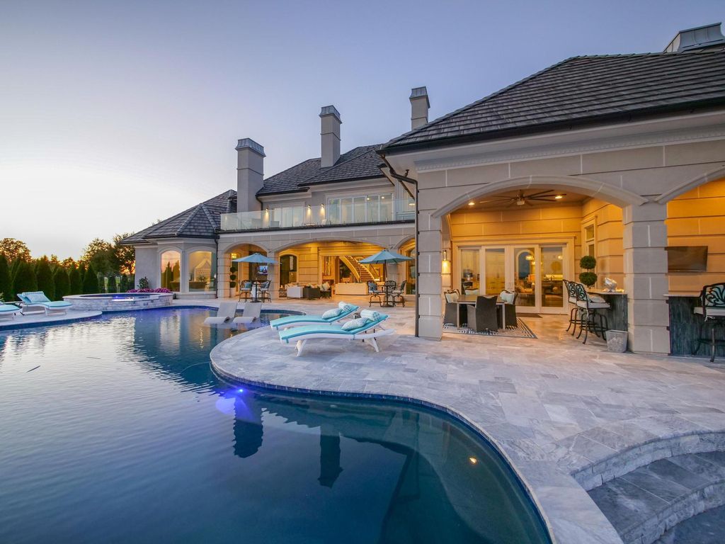 12768 Highwick Circle Home in Knoxville, Tennessee. Explore the epitome of luxury living at this architectural masterpiece nestled in prestigious Bridgemore. Perched atop Farragut's highest point, this one-of-a-kind home offers breathtaking views of the mountains and lake. 