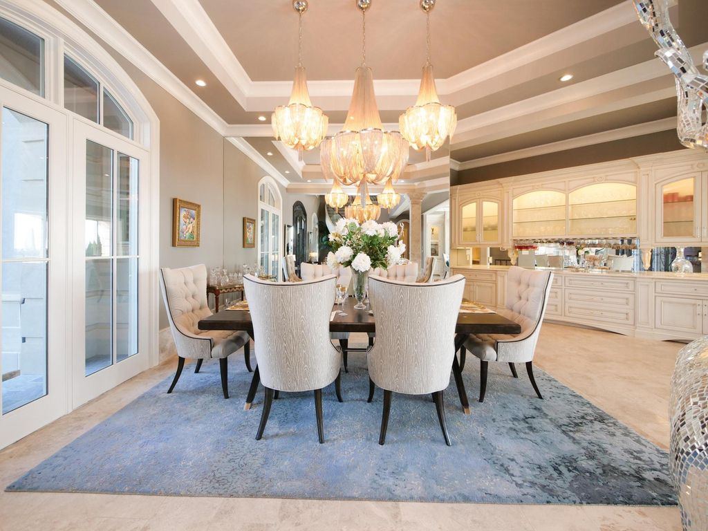 12768 Highwick Circle Home in Knoxville, Tennessee. Explore the epitome of luxury living at this architectural masterpiece nestled in prestigious Bridgemore. Perched atop Farragut's highest point, this one-of-a-kind home offers breathtaking views of the mountains and lake. 