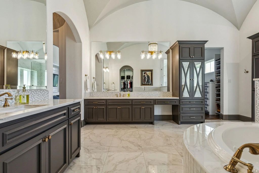 1621 Jan Marie Drive Home in Lucas, Texas. Discover unparalleled luxury in this custom J. Anthony home quietly nestled on a 2-acre north-facing cul-de-sac in prestigious Lovejoy ISD. Featuring exceptional design, premium fixtures, and abundant natural light, this home offers an open concept living area with exposed beams and a gourmet kitchen with dual islands and quartz countertops.