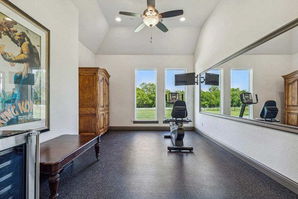 1621 Jan Marie Drive Home in Lucas, Texas. Discover unparalleled luxury in this custom J. Anthony home quietly nestled on a 2-acre north-facing cul-de-sac in prestigious Lovejoy ISD. Featuring exceptional design, premium fixtures, and abundant natural light, this home offers an open concept living area with exposed beams and a gourmet kitchen with dual islands and quartz countertops.
