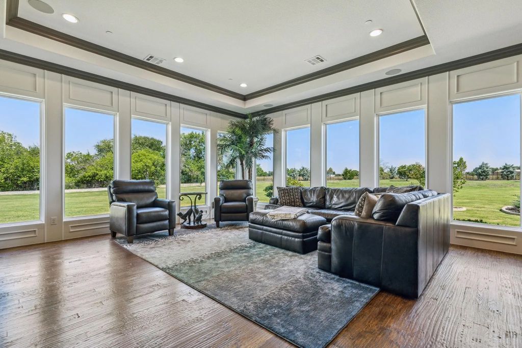 1621 Jan Marie Drive Home in Lucas, Texas. Discover unparalleled luxury in this custom J. Anthony home quietly nestled on a 2-acre north-facing cul-de-sac in prestigious Lovejoy ISD. Featuring exceptional design, premium fixtures, and abundant natural light, this home offers an open concept living area with exposed beams and a gourmet kitchen with dual islands and quartz countertops.