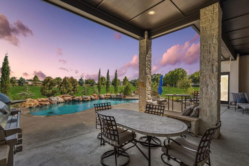 1621 Jan Marie Drive Home in Lucas, Texas. Discover unparalleled luxury in this custom J. Anthony home quietly nestled on a 2-acre north-facing cul-de-sac in prestigious Lovejoy ISD. Featuring exceptional design, premium fixtures, and abundant natural light, this home offers an open concept living area with exposed beams and a gourmet kitchen with dual islands and quartz countertops.