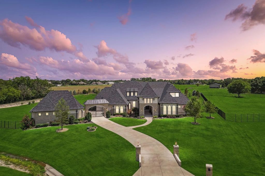 1621 Jan Marie Drive Home in Lucas, Texas. Discover unparalleled luxury in this custom J. Anthony home quietly nestled on a 2-acre north-facing cul-de-sac in prestigious Lovejoy ISD. Featuring exceptional design, premium fixtures, and abundant natural light, this home offers an open concept living area with exposed beams and a gourmet kitchen with dual islands and quartz countertops.