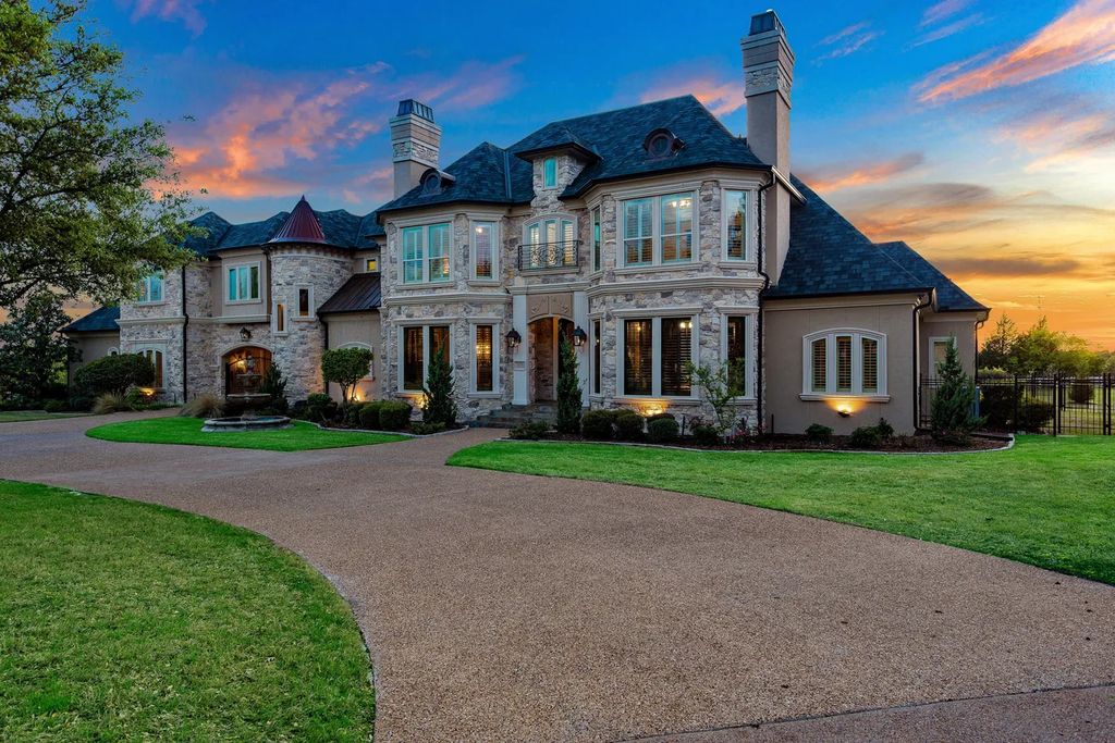 920 Broken Lance Lane Home in Rockwall, Texas. Discover the epitome of luxury living in this French-inspired estate nestled within a lakeside community near Dallas amenities. With 61 estate homes in the gated Oaks of Buffalo Way, this property exudes elegance with its wrought-iron porte cochere, NEW roof with copper turret, and 5 fireplaces.