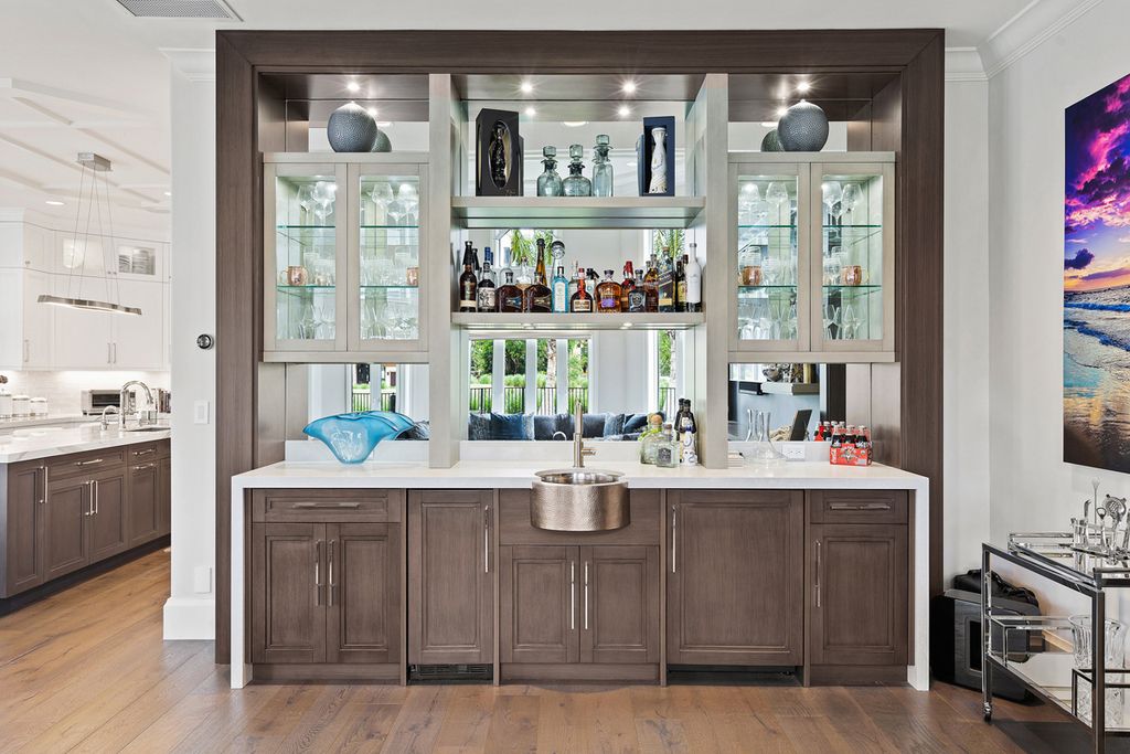 311 Fan Palm Road Home in Boca Raton, Florida. Discover contemporary elegance in this 5-bedroom golf course home at 311 Fan Palm Road, meticulously renovated to showcase brand new construction. Located in the esteemed Royal Palm Yacht & Country Club.