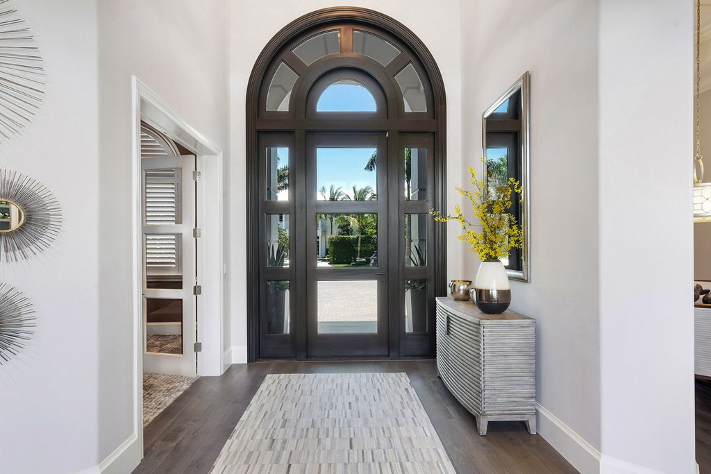 311 Fan Palm Road Home in Boca Raton, Florida. Discover contemporary elegance in this 5-bedroom golf course home at 311 Fan Palm Road, meticulously renovated to showcase brand new construction. Located in the esteemed Royal Palm Yacht & Country Club.