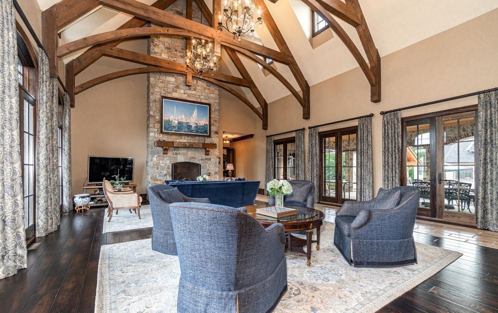 65 Brown Road Home in Stillwater, New York. Experience unparalleled luxury in this exquisite French Country Chateau nestled on 15 acres with stunning views of Saratoga Lake. Boasting 7,237 SF, this custom mansion features 5 bedroom suites, 7.5 baths, and a separate pool house with kitchenette, bathroom, and fireplace. 