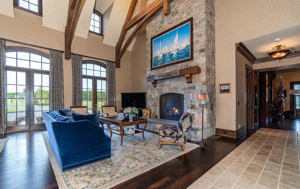 65 Brown Road Home in Stillwater, New York. Experience unparalleled luxury in this exquisite French Country Chateau nestled on 15 acres with stunning views of Saratoga Lake. Boasting 7,237 SF, this custom mansion features 5 bedroom suites, 7.5 baths, and a separate pool house with kitchenette, bathroom, and fireplace. 