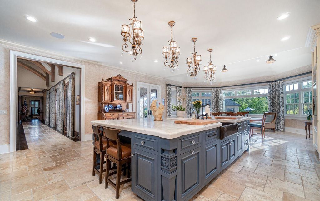65 Brown Road Home in Stillwater, New York. Experience unparalleled luxury in this exquisite French Country Chateau nestled on 15 acres with stunning views of Saratoga Lake. Boasting 7,237 SF, this custom mansion features 5 bedroom suites, 7.5 baths, and a separate pool house with kitchenette, bathroom, and fireplace. 