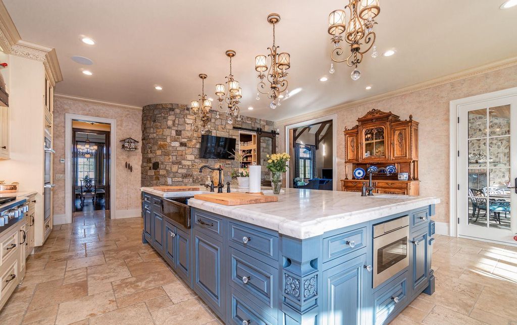65 Brown Road Home in Stillwater, New York. Experience unparalleled luxury in this exquisite French Country Chateau nestled on 15 acres with stunning views of Saratoga Lake. Boasting 7,237 SF, this custom mansion features 5 bedroom suites, 7.5 baths, and a separate pool house with kitchenette, bathroom, and fireplace. 