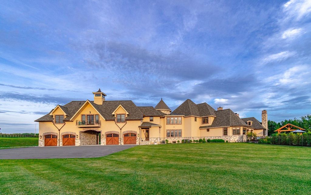 65 Brown Road Home in Stillwater, New York. Experience unparalleled luxury in this exquisite French Country Chateau nestled on 15 acres with stunning views of Saratoga Lake. Boasting 7,237 SF, this custom mansion features 5 bedroom suites, 7.5 baths, and a separate pool house with kitchenette, bathroom, and fireplace. 