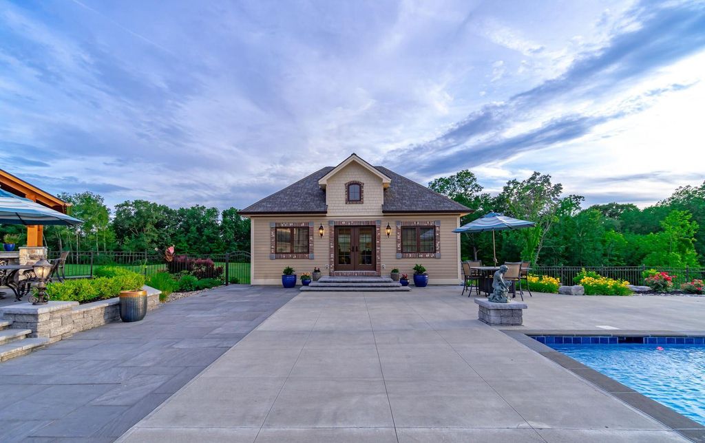 65 Brown Road Home in Stillwater, New York. Experience unparalleled luxury in this exquisite French Country Chateau nestled on 15 acres with stunning views of Saratoga Lake. Boasting 7,237 SF, this custom mansion features 5 bedroom suites, 7.5 baths, and a separate pool house with kitchenette, bathroom, and fireplace. 