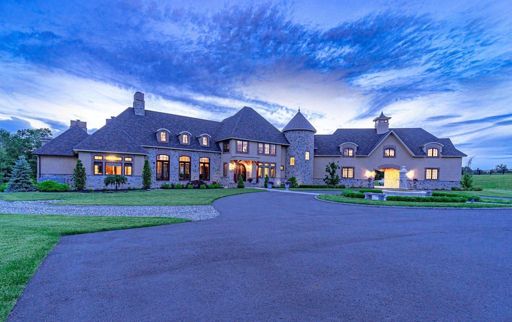 65 Brown Road Home in Stillwater, New York. Experience unparalleled luxury in this exquisite French Country Chateau nestled on 15 acres with stunning views of Saratoga Lake. Boasting 7,237 SF, this custom mansion features 5 bedroom suites, 7.5 baths, and a separate pool house with kitchenette, bathroom, and fireplace. 
