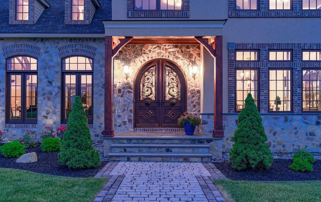 65 Brown Road Home in Stillwater, New York. Experience unparalleled luxury in this exquisite French Country Chateau nestled on 15 acres with stunning views of Saratoga Lake. Boasting 7,237 SF, this custom mansion features 5 bedroom suites, 7.5 baths, and a separate pool house with kitchenette, bathroom, and fireplace. 