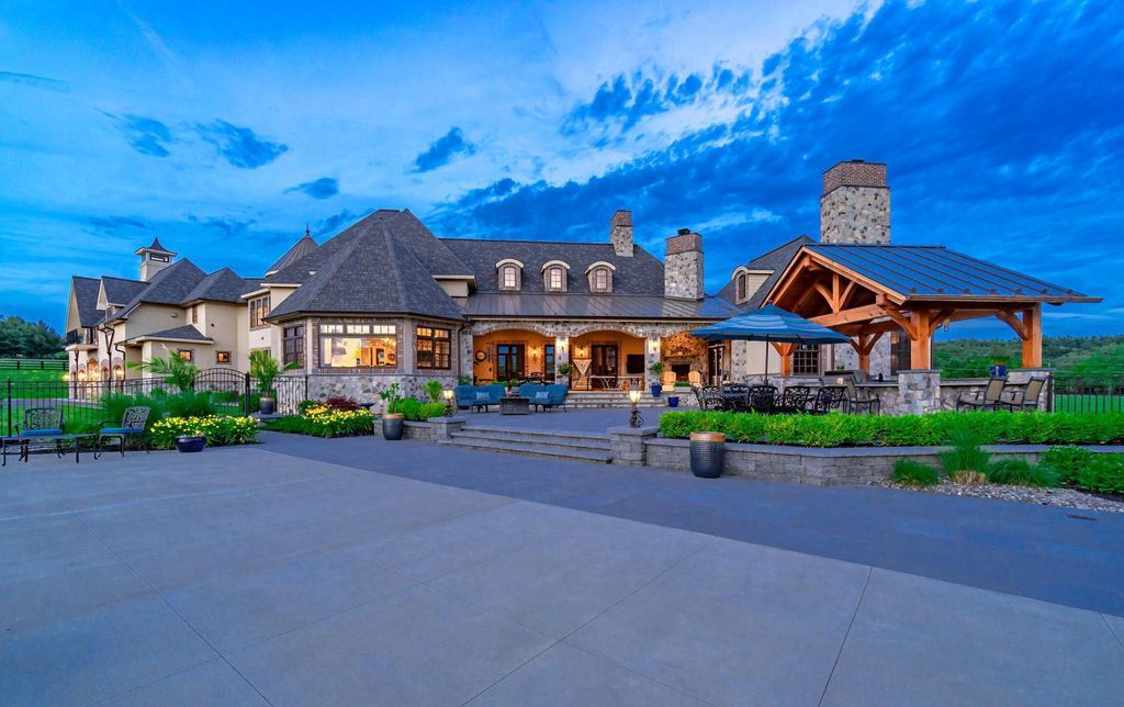 65 Brown Road Home in Stillwater, New York. Experience unparalleled luxury in this exquisite French Country Chateau nestled on 15 acres with stunning views of Saratoga Lake. Boasting 7,237 SF, this custom mansion features 5 bedroom suites, 7.5 baths, and a separate pool house with kitchenette, bathroom, and fireplace. 