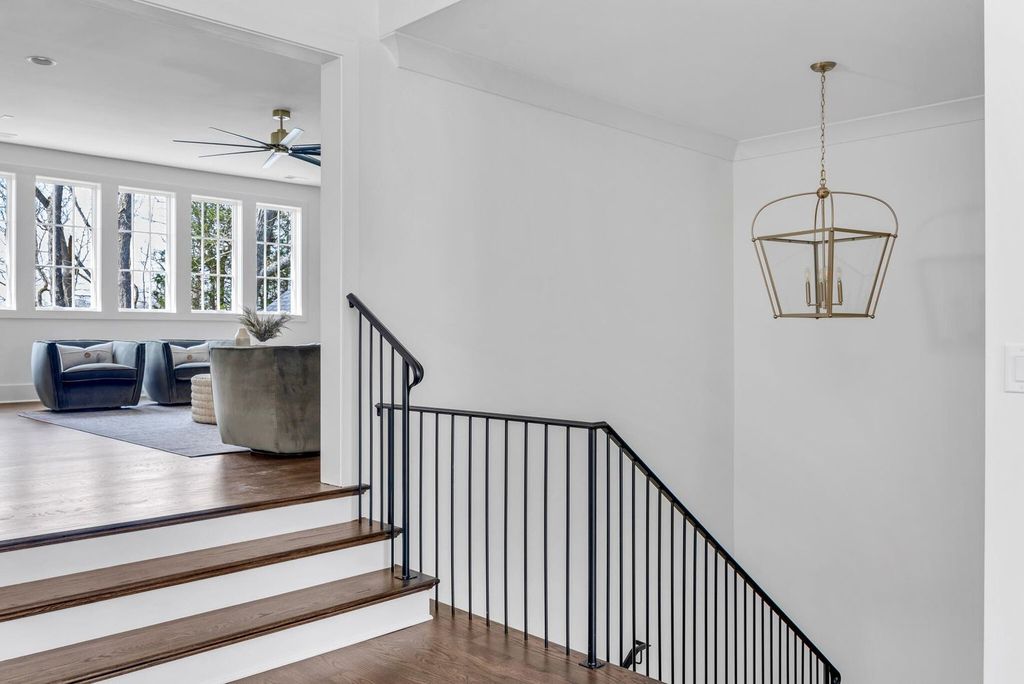 715 Greeley Drive Home in Nashville, Tennessee. Discover the epitome of refined luxury living in this meticulously crafted Southern Traditional home by Vintage South Development. Boasting 5 bedrooms, 5.5 bathrooms, and a wealth of functional spaces including a home gym and two rec rooms, this home seamlessly blends classic architecture with modern innovation. 