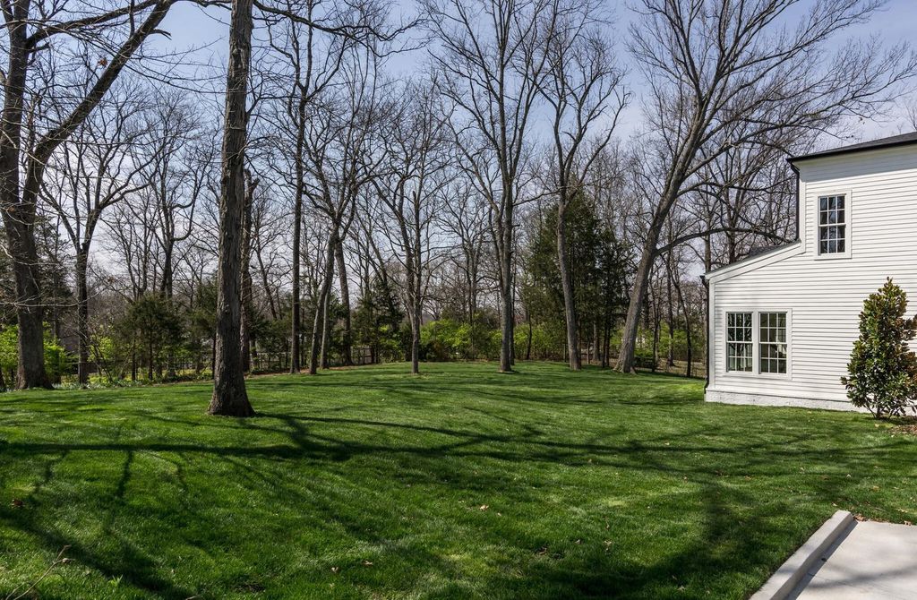 715 Greeley Drive Home in Nashville, Tennessee. Discover the epitome of refined luxury living in this meticulously crafted Southern Traditional home by Vintage South Development. Boasting 5 bedrooms, 5.5 bathrooms, and a wealth of functional spaces including a home gym and two rec rooms, this home seamlessly blends classic architecture with modern innovation. 