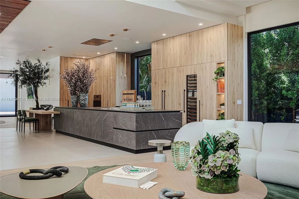 Discover The Grove on Park Oaks, a luxurious haven in Miami's sought-after Coconut Grove neighborhood. With over 14,000 square feet of living and entertainment space, this residence epitomizes modern elegance and comfort.