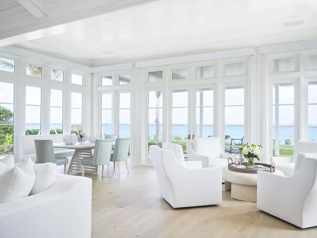 Welcome to 11432 Turtle Beach Road, an exquisite oceanfront property in North Palm Beach, FL, offering 7 bedrooms, 7 bathrooms, and 7,823 square feet of luxury living space on a sprawling 0.80-acre lot. This meticulously renovated home seamlessly blends elegance with casual beach living, featuring separate guest and living quarters that capture both east and west exposures, inviting ocean breezes, and abundant natural light