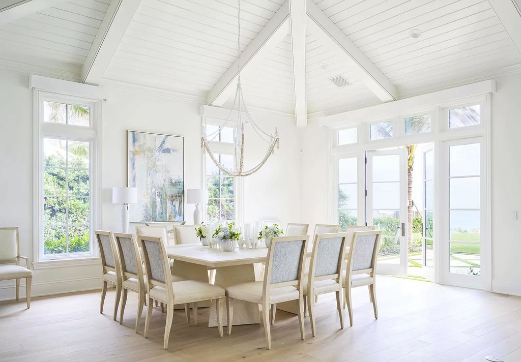 Welcome to 11432 Turtle Beach Road, an exquisite oceanfront property in North Palm Beach, FL, offering 7 bedrooms, 7 bathrooms, and 7,823 square feet of luxury living space on a sprawling 0.80-acre lot. This meticulously renovated home seamlessly blends elegance with casual beach living, featuring separate guest and living quarters that capture both east and west exposures, inviting ocean breezes, and abundant natural light
