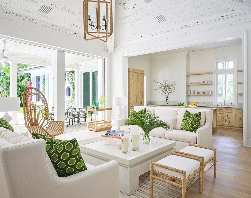 Welcome to 11432 Turtle Beach Road, an exquisite oceanfront property in North Palm Beach, FL, offering 7 bedrooms, 7 bathrooms, and 7,823 square feet of luxury living space on a sprawling 0.80-acre lot. This meticulously renovated home seamlessly blends elegance with casual beach living, featuring separate guest and living quarters that capture both east and west exposures, inviting ocean breezes, and abundant natural light