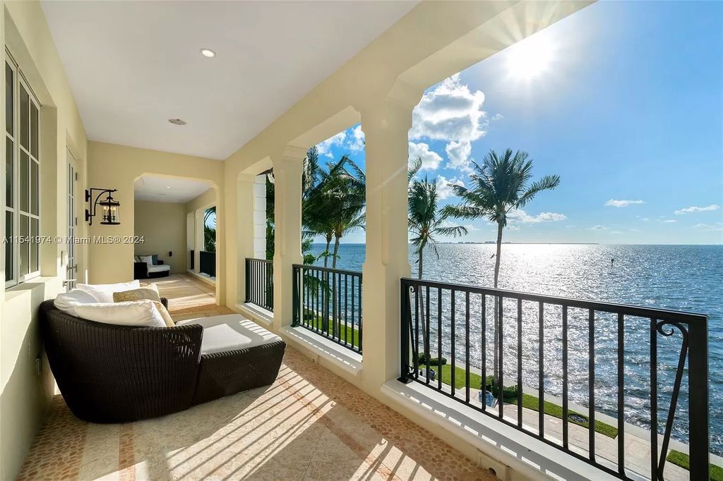 Nestled within the prestigious guard-gated community of Gables Estates, 33 Arvida Parkway presents a magnificent 14,972-square-foot estate boasting 225 feet of waterfront on a lushly landscaped 35,389-square-foot lot.