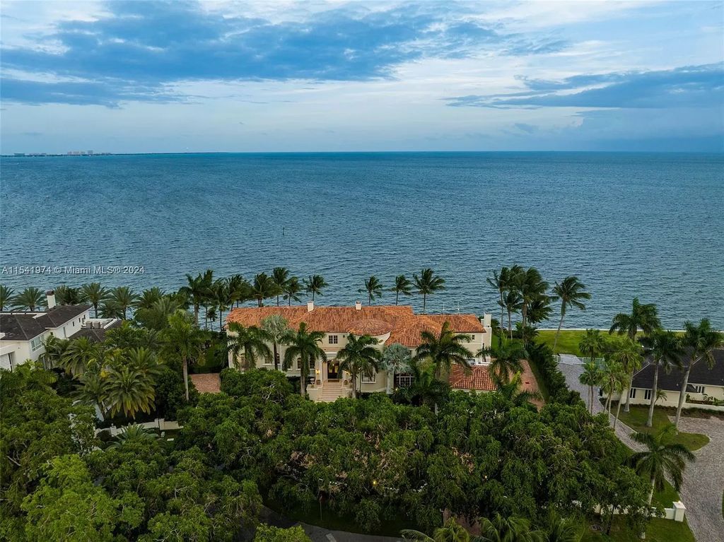 Nestled within the prestigious guard-gated community of Gables Estates, 33 Arvida Parkway presents a magnificent 14,972-square-foot estate boasting 225 feet of waterfront on a lushly landscaped 35,389-square-foot lot.